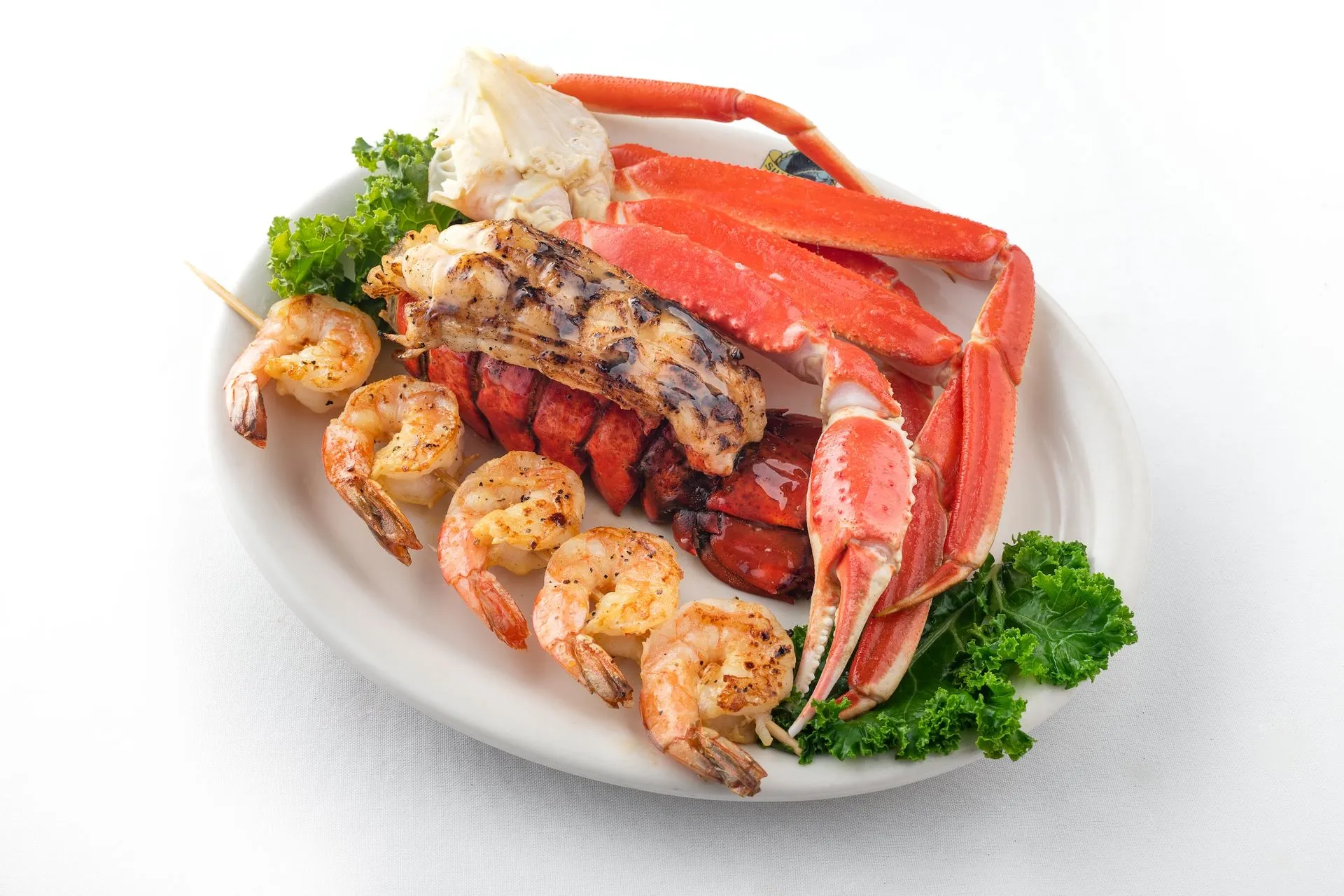 Crab legs, lobster tail, and grilled shrimp meal at Blue Ocean Seafood