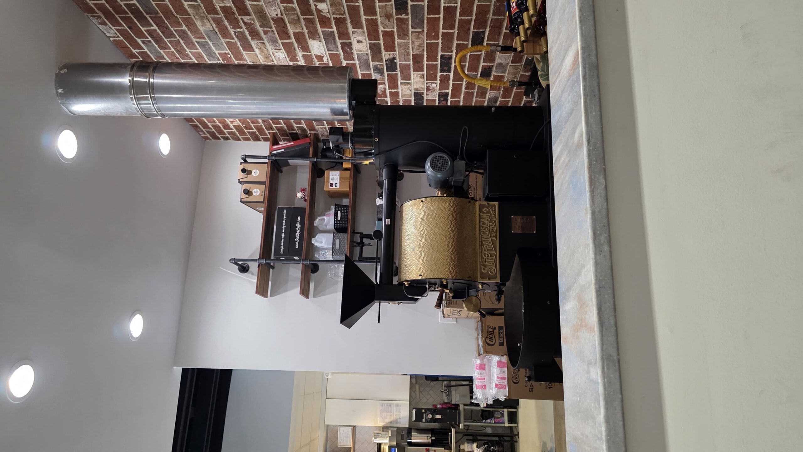 Commercial coffee roasting equipment inside Goat Kick Coffee