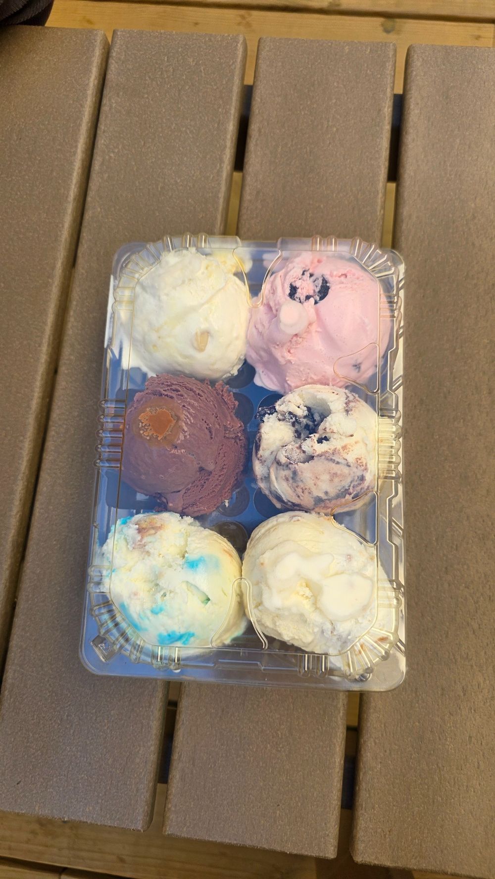 Six scoops of ice cream in a tray from Village Scoop in Chimney Rock