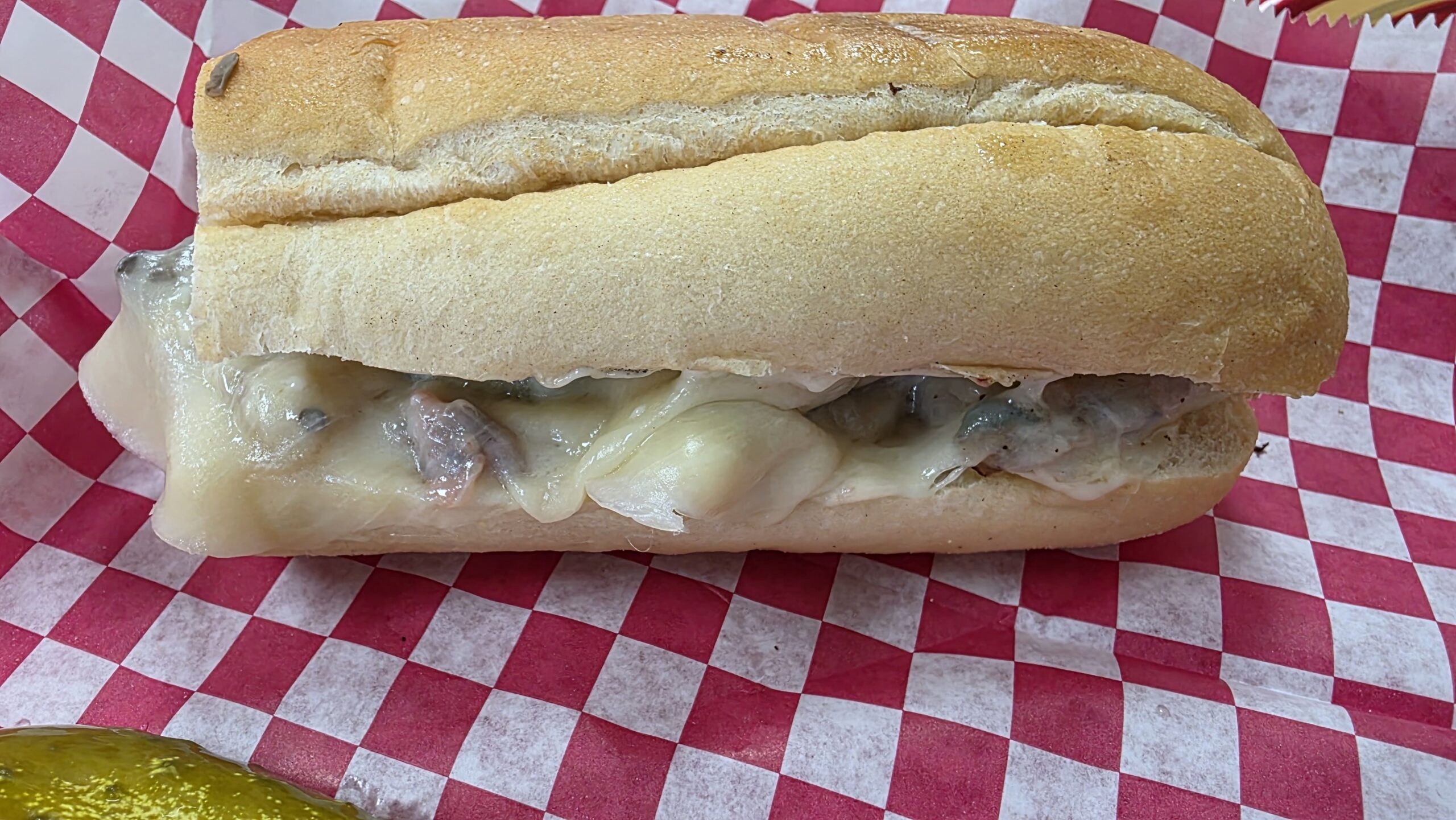Hot sub with melted cheese at Just Julie’s Sandwich Shop
