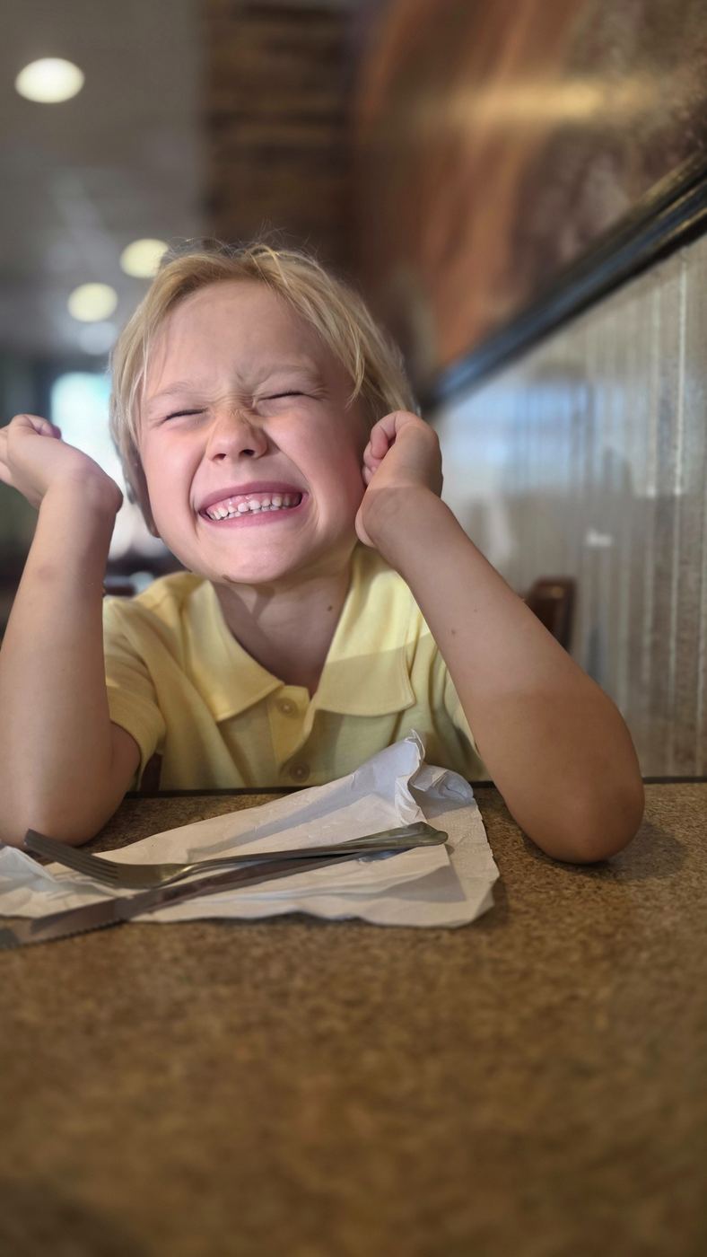 Child enjoying a family meal at Antonio's Italian Eatery in North Augusta