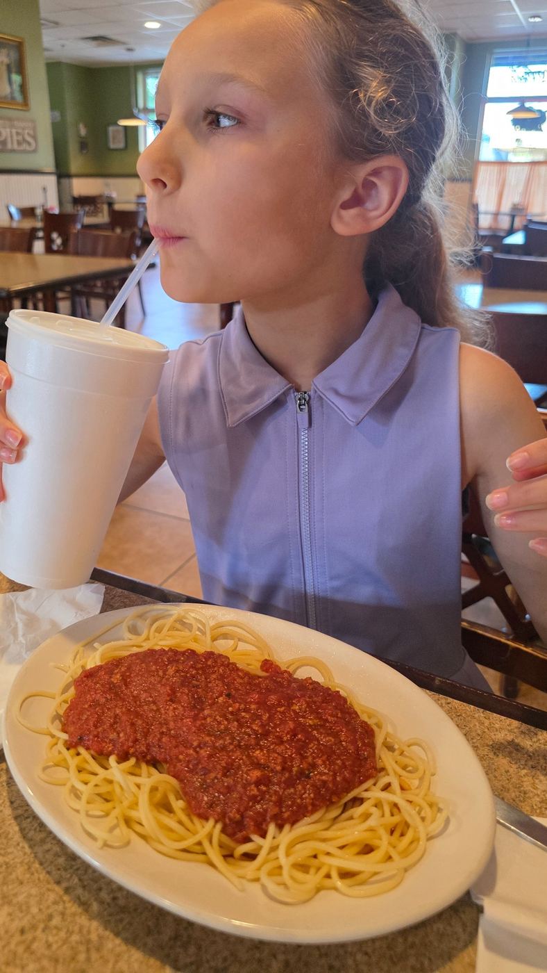 Child with spaghetti and meat sauce at Antonio's Italian Eatery